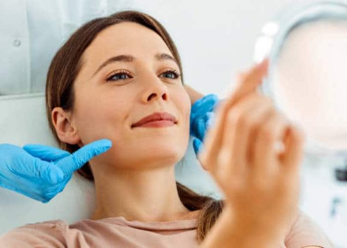 Young Beautiful Woman Having Various Facial Treatment